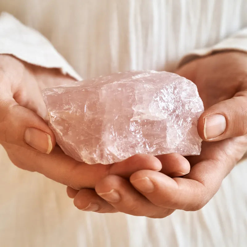 Soft pink rose quartz jewelry styled for a piece on rose quartz in your fifties
