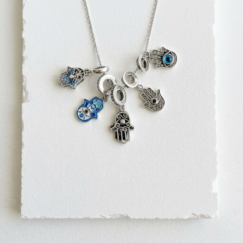 Hamsa hand jewelry, hamsa hand meaning, history and how to wear this protection symbol
