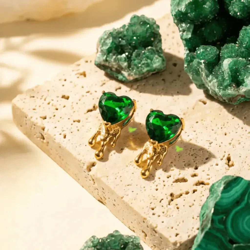 Emerald green bleeding heart stud earrings in gold, glass jewelry that catches the light