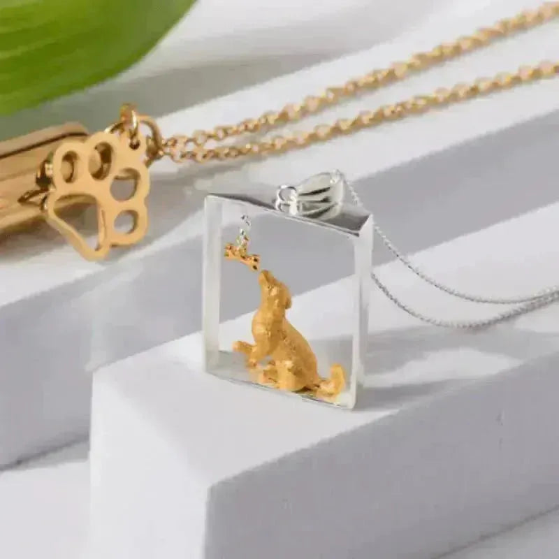 Sterling silver dog and bone pendant necklace from the Crystals & Paws rescue collection