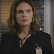 emily daschenel dr brennace bones wearing a black outfit with a name tag in an indoor setting