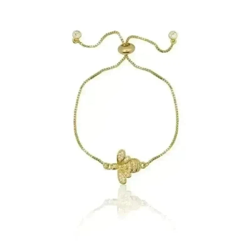 Gold turtle bracelet on a white background