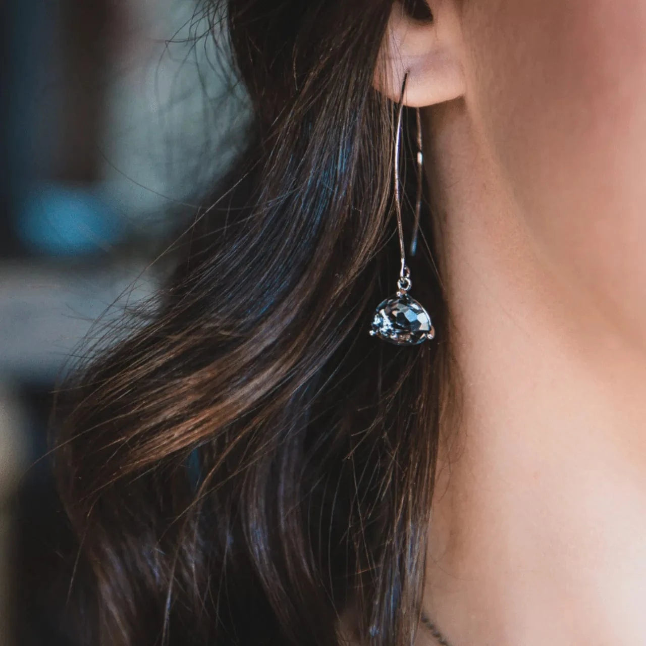 earrings on woman with brown hair