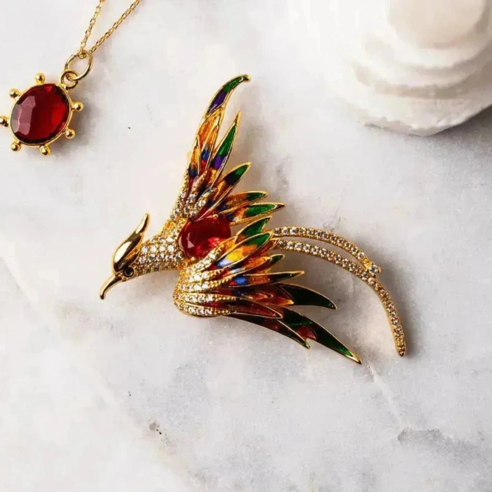 phoenix pin in red and gold garnet necklace