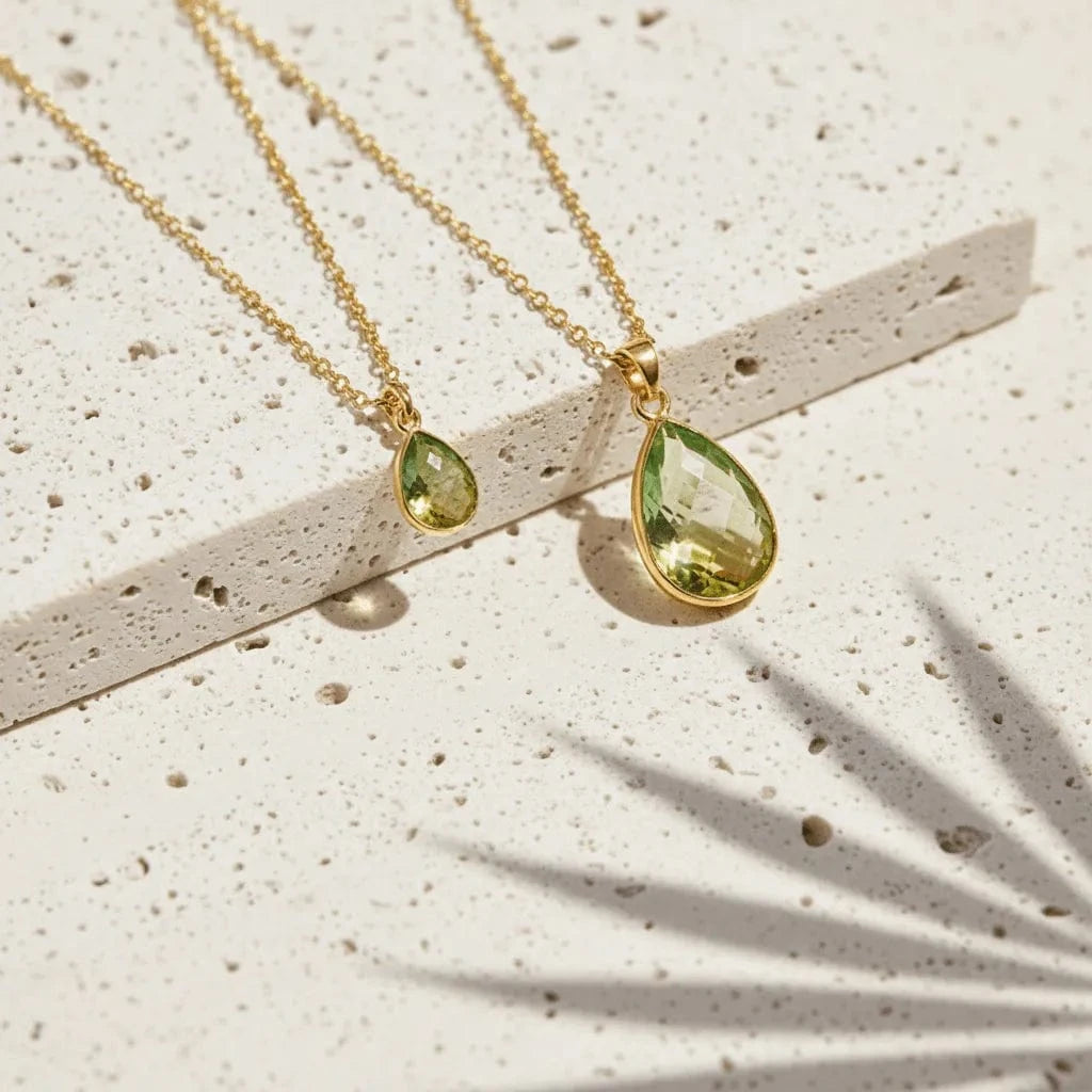 green gold necklaces on pourus stone background