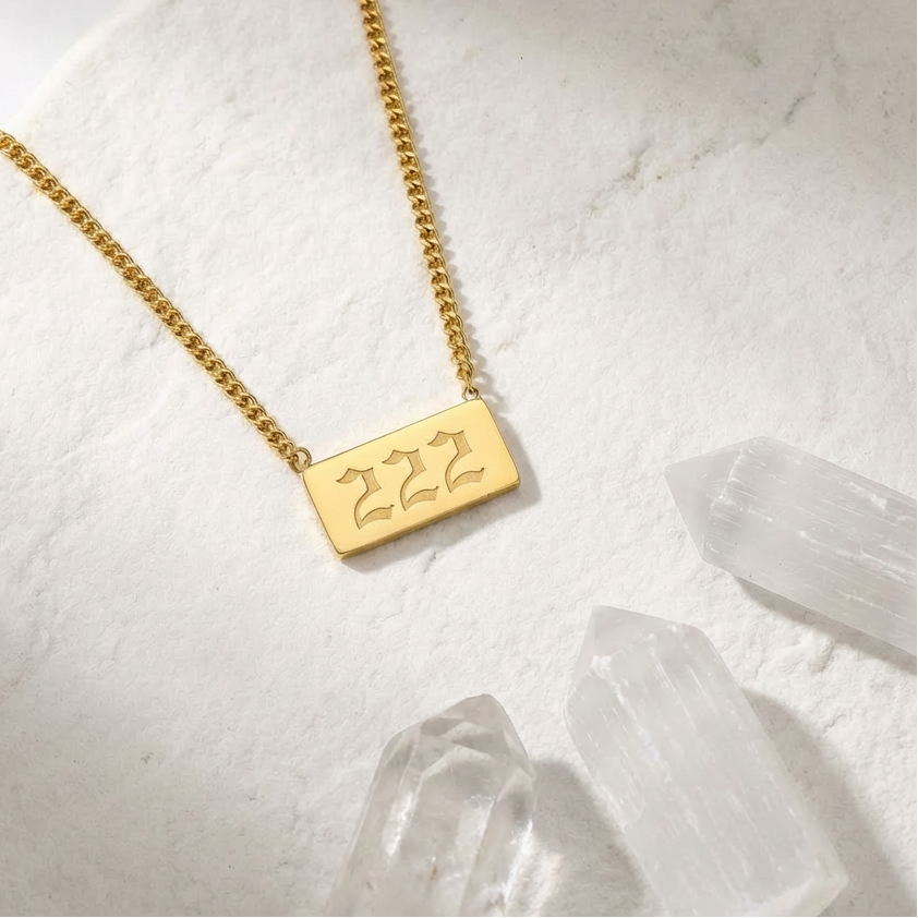 BLOG 222 angel number pendant necklace in gold on white background