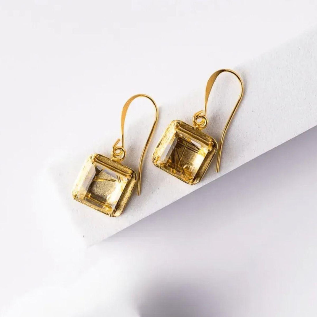 Rutilated quartz jewelry — golden, black and pink rutile meaning and how to wear it