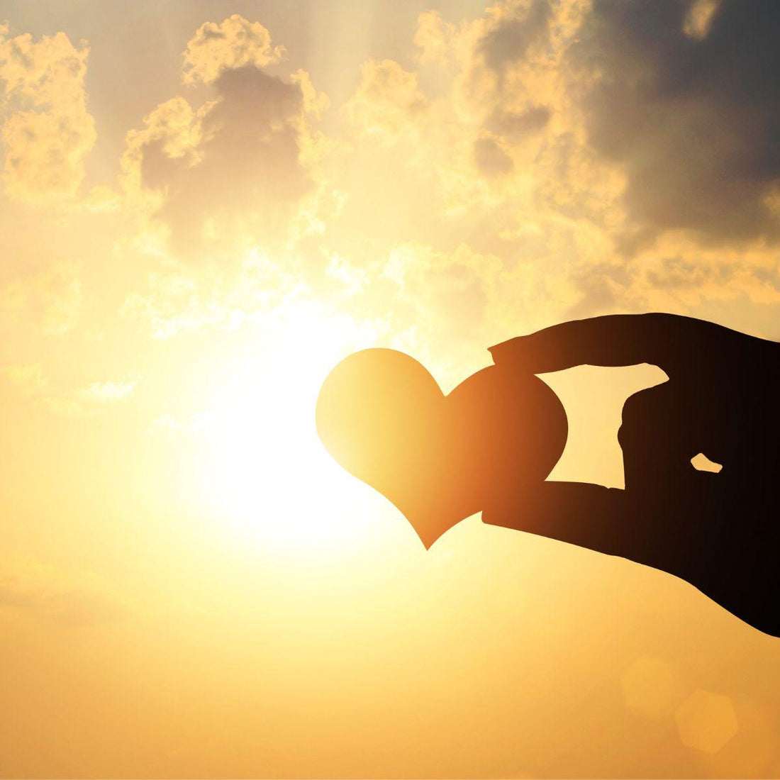 Hand holding a heart up to the sun — Friendship in Your 40s, the Real Kind, Part Three of Coming Back to Yourself by Shannon Yerxa