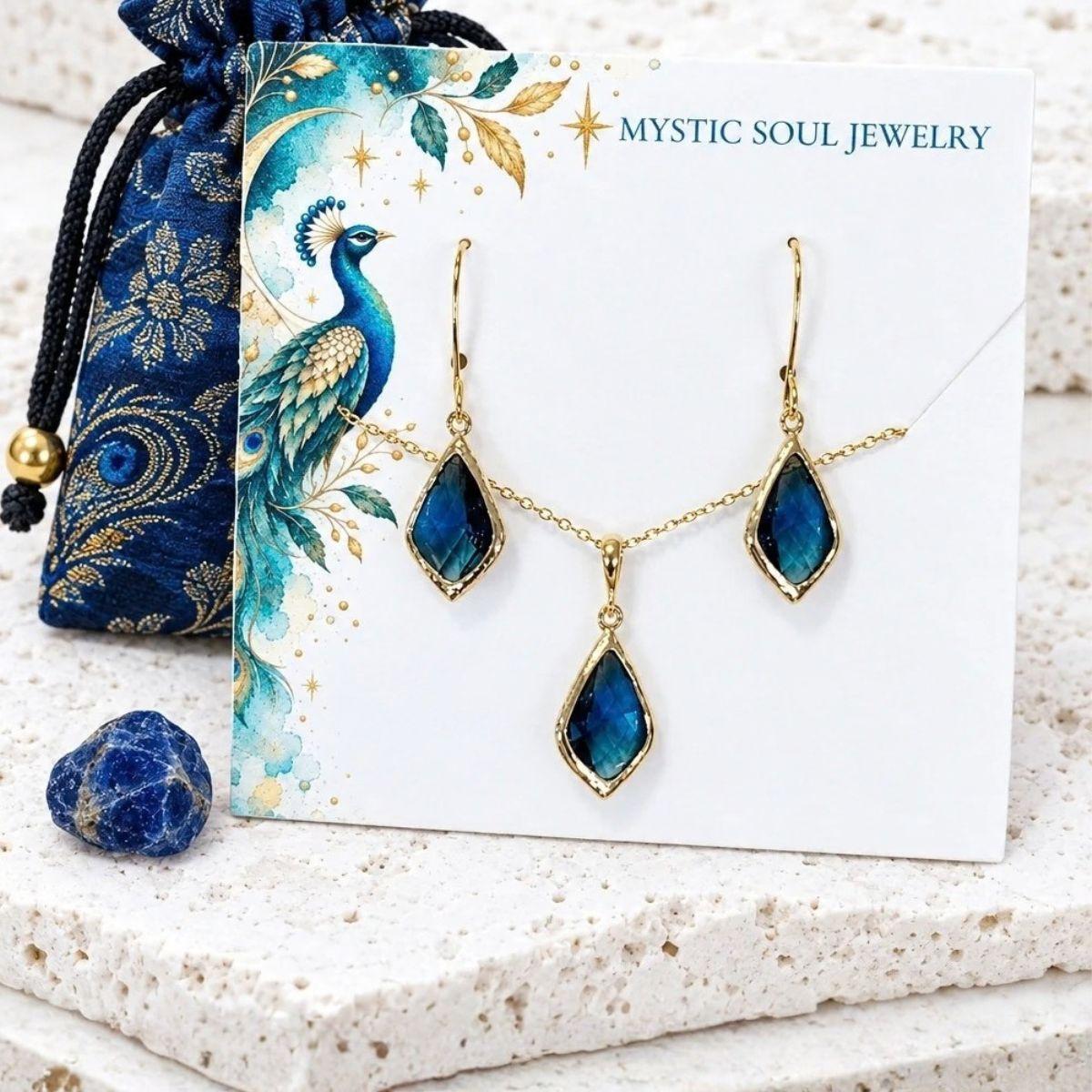 Sapphire blue glass jewelry in gold from the Glass & Light bench line — the sparkle that doesn't apologize