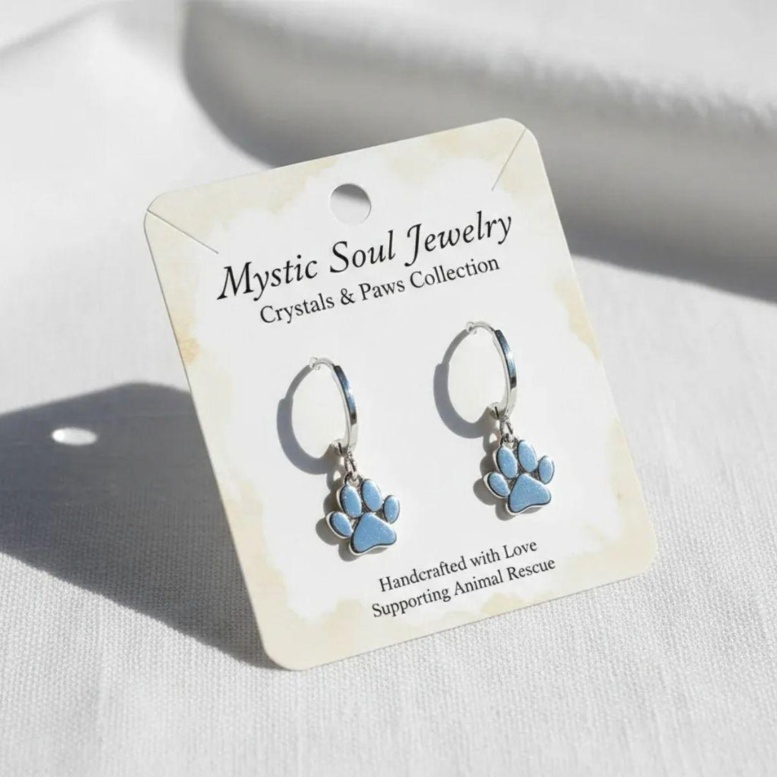 Crystals & Paws earrings on a meaning card — which crystals are safe around pets