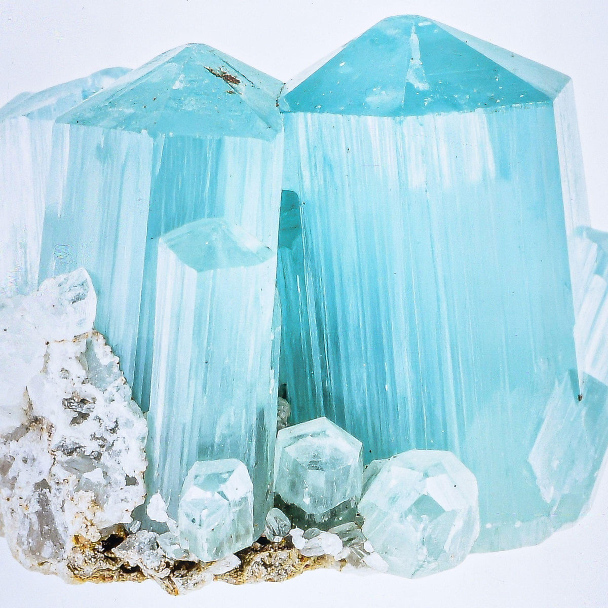 Aquamarine — the March birthstone, raw pale sea-blue crystal