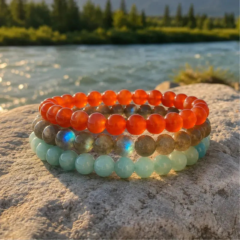 A stack of red and white crystal bracelets styled for Canada Day