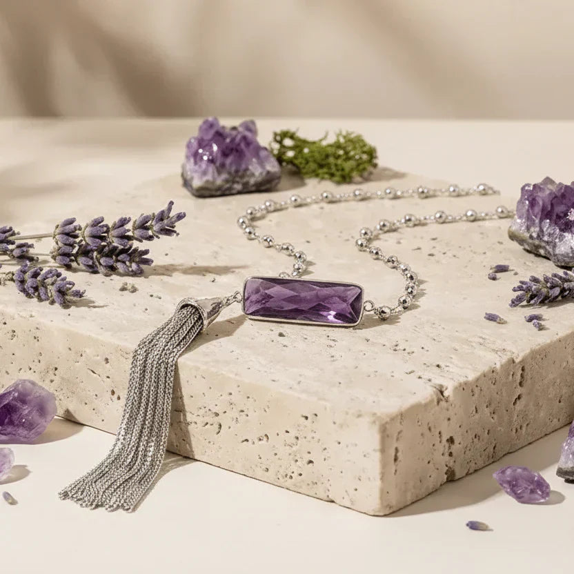 Amethyst silver tassel necklace on light background with lavendar