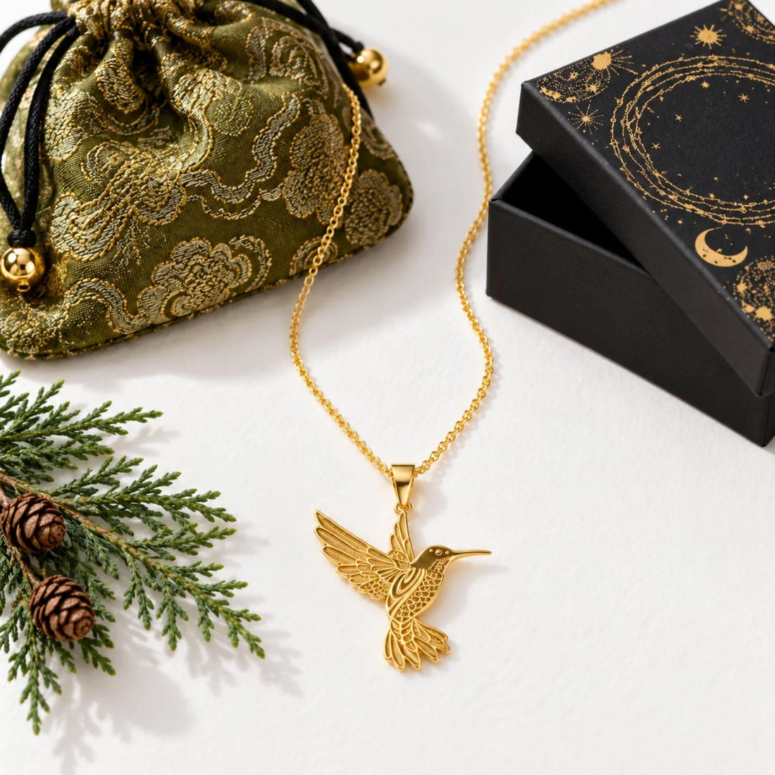 Gold hummingbird pendant with the Mystic Soul gift bag and celestial box, cover for what to give someone having a hard year