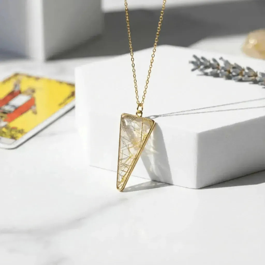 Golden rutilated quartz pendant with visible rutile needle inclusions — clarity and intention jewelry