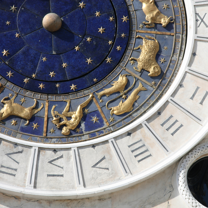 BLOG Pisces astrology symbol on zodiac clock