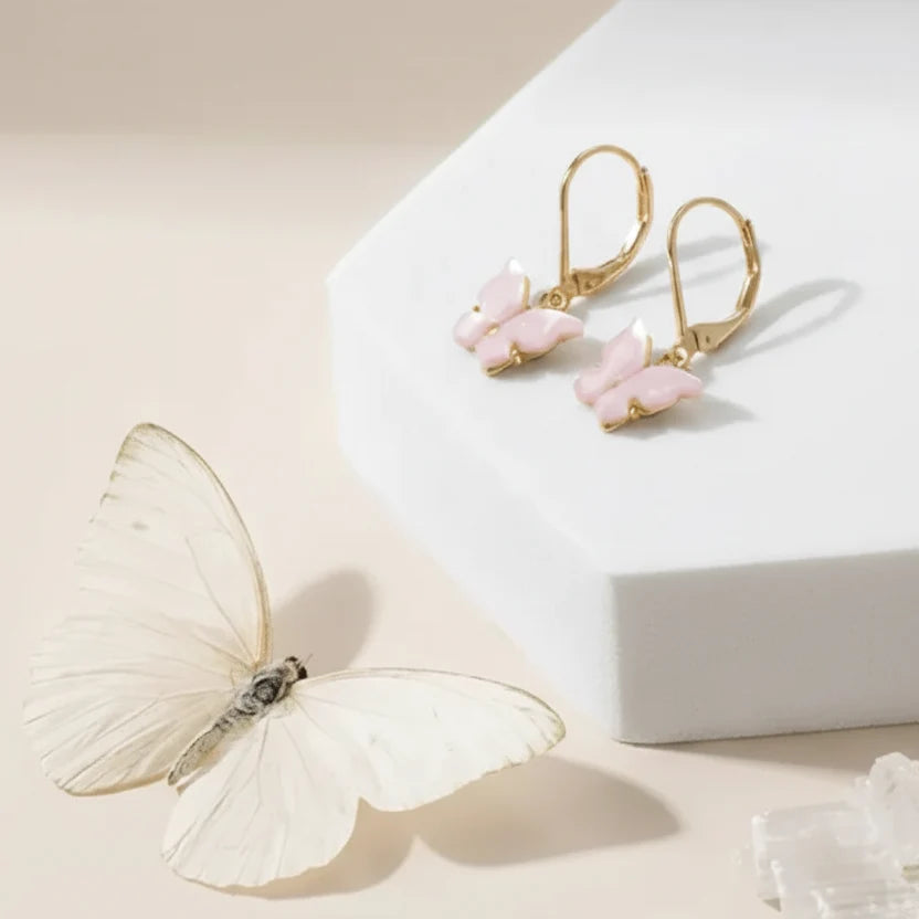 Gold and pink butterfly earrings — transformation and spirit animal jewelry