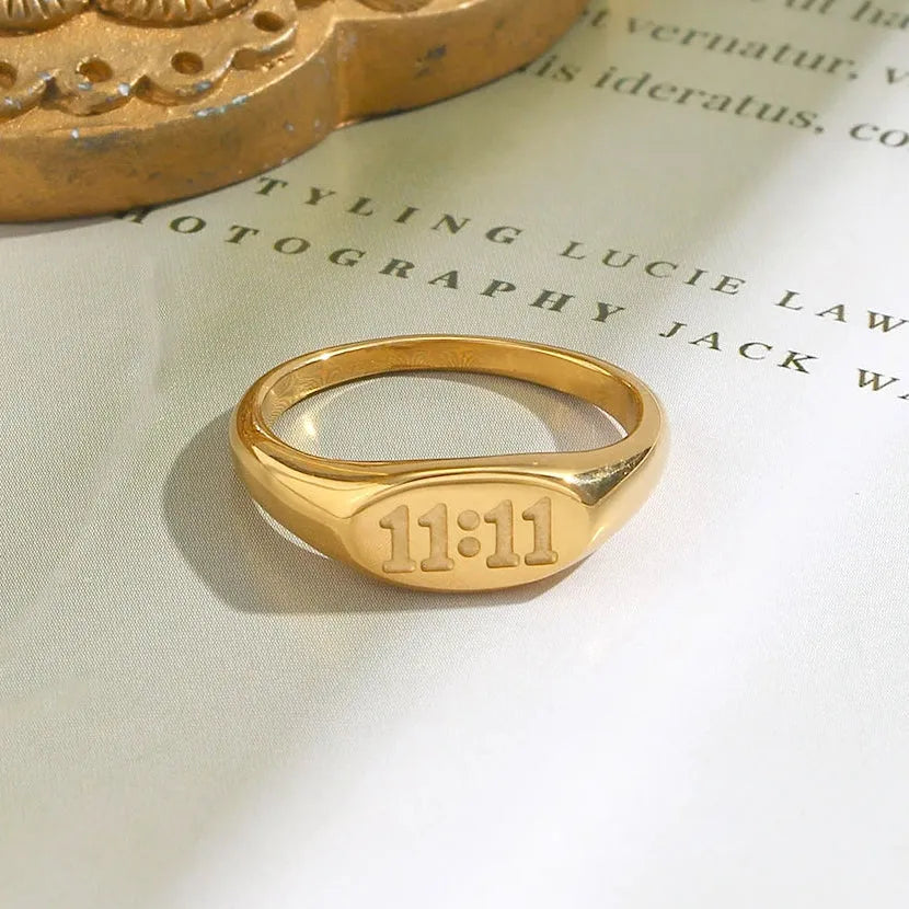 Gold 11:11 angel number oval band rings — tarnish-free 316L stainless steel, sizes 5–9