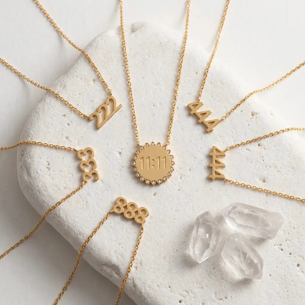 222 333 444 888 1111 Gold angel number pendant necklaces  stainless steel, displayed on stone surface