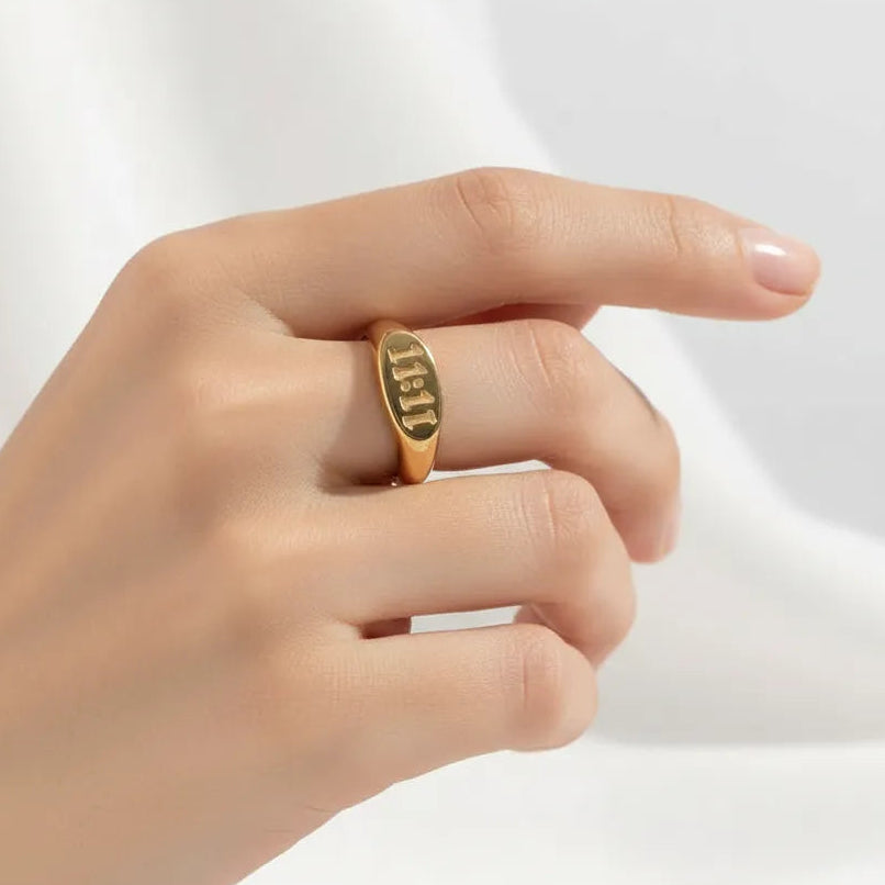 1111 angel number ring in gold worn on the hand, angel number jewelry