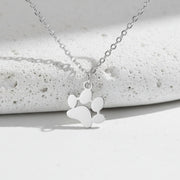 Silver necklace with a heart-shaped pendant on a white background