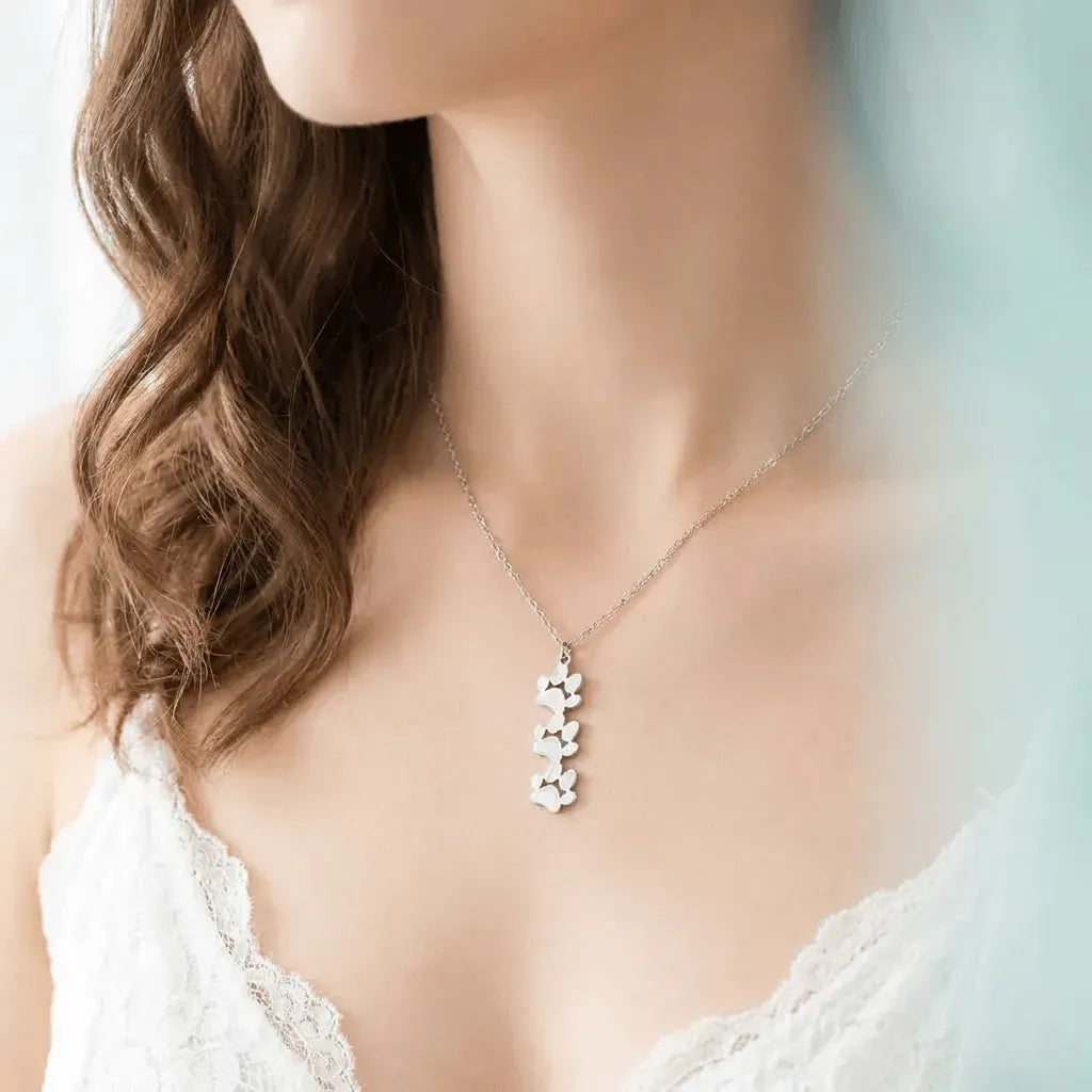 Woman wearing a delicate necklace with a blurred background