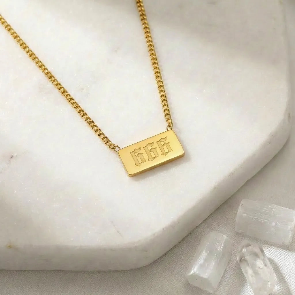 666 angel number rectangle pendant necklace with crystals on a light background