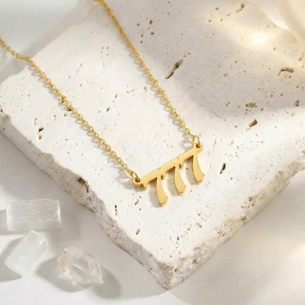 777 Gold angel number pendant necklaces — stainless steel on white background