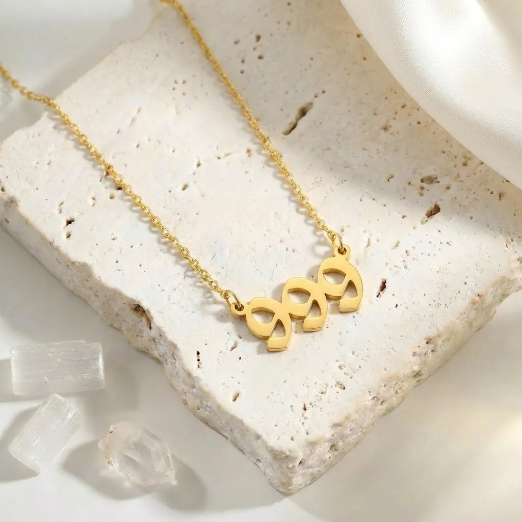 999 Gold angel number pendant necklaces — stainless steel on white background