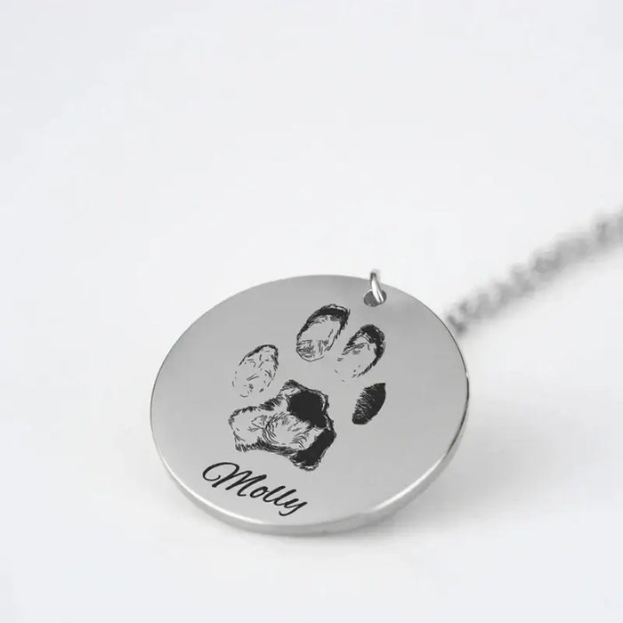 Custom paw print charm necklace with engraved name 'Molly' for pet lovers.