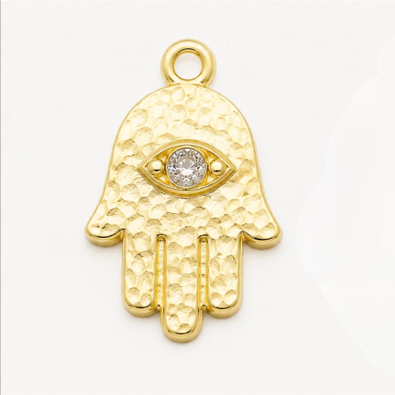 Hamsa charm shown attached to a beaded stretch bracelet