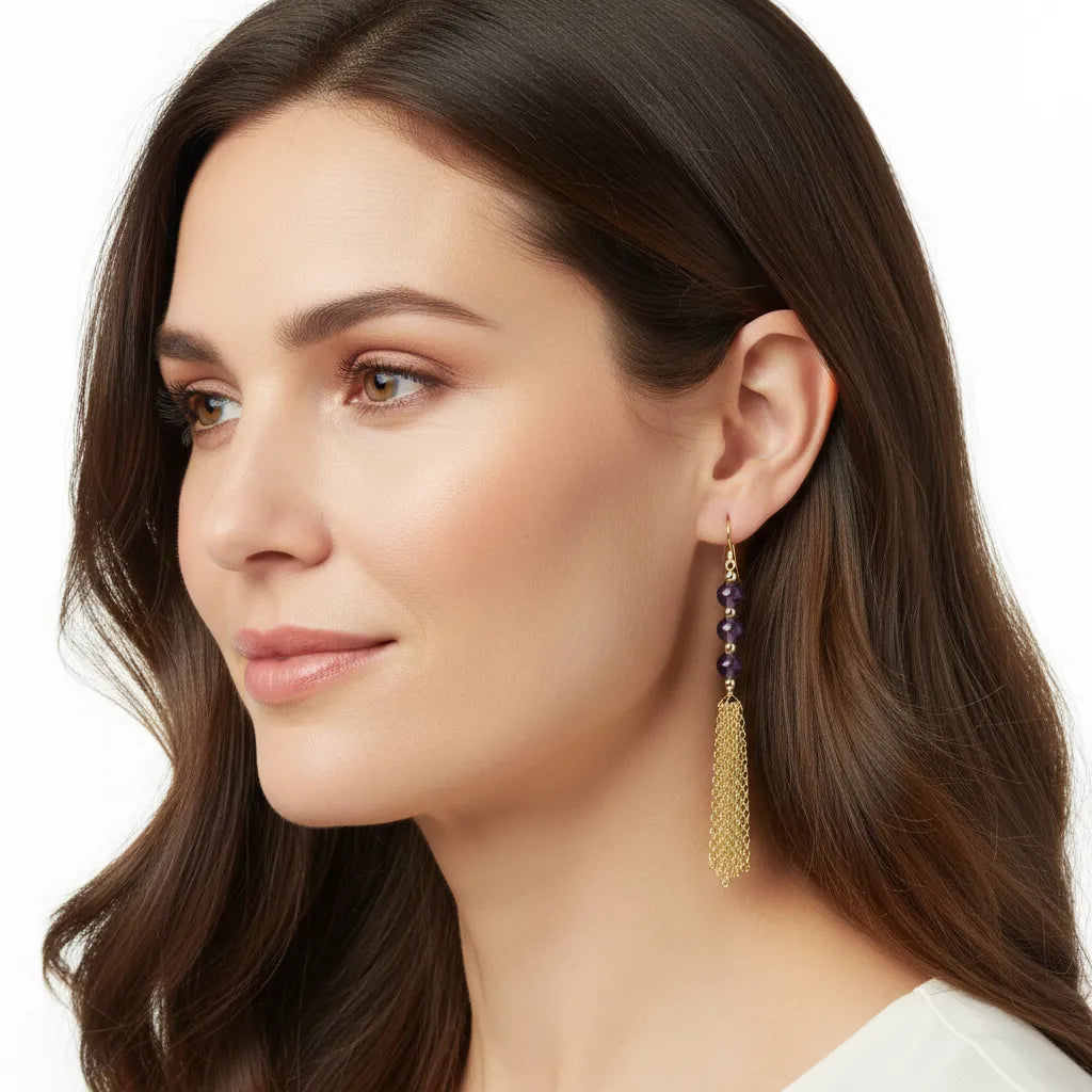 woman wearing gold amethyst chain dangle earrings — February birthstone jewelry