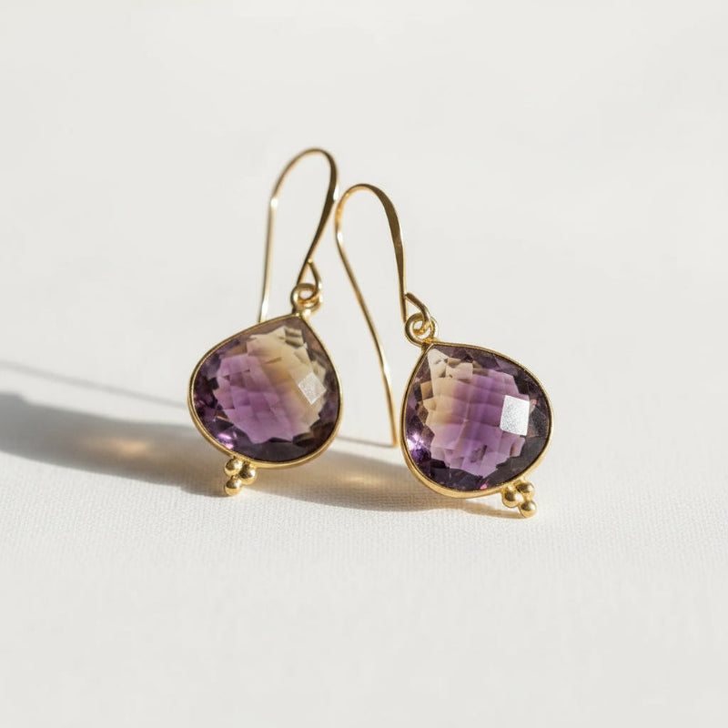 gold ametrine gemstone drop earrings close-up — crystal jewelry for balance