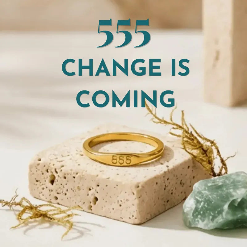 Gold ring with '555' on a stone block with text 'CHANGE IS COMING' in the background