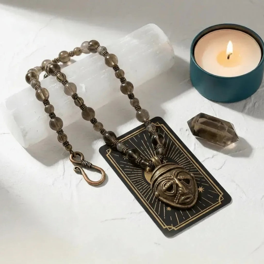 Original Bones mask necklace on branded Mystic Soul Jewelry card with candle and crystal, screen-worn design handcrafted by Andrea.