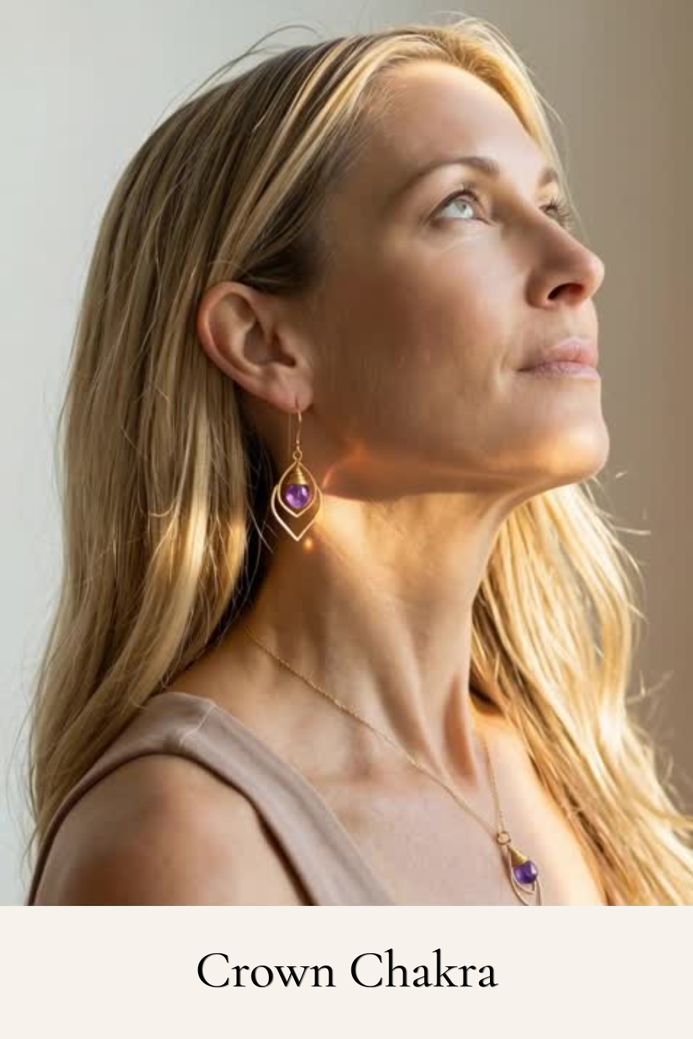 Woman wearing earrings with a neutral background
