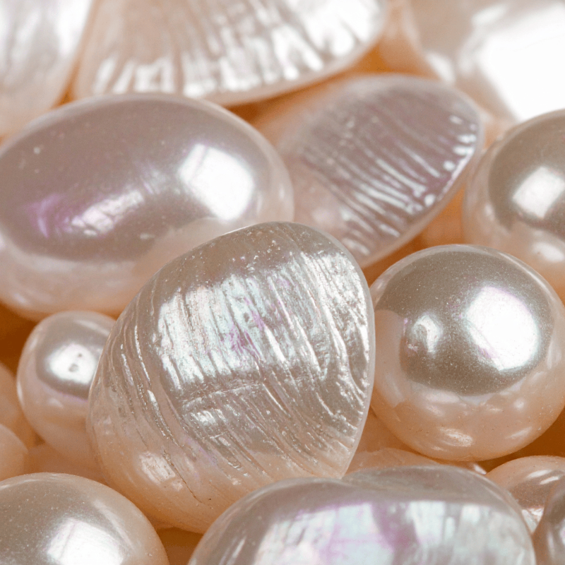 Close-up of multiple pearls with a soft focus background