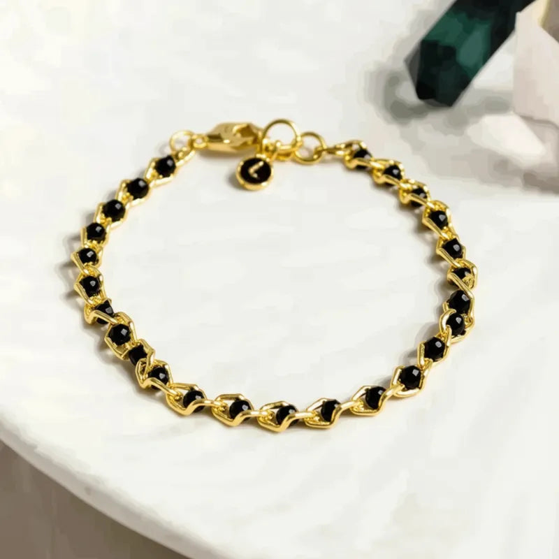 Black ball chain bracelet with a silver clasp