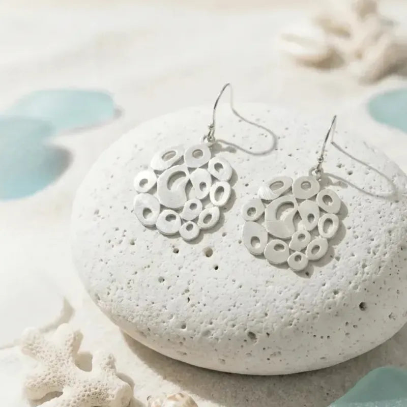 Bubble drop earrings shown on display