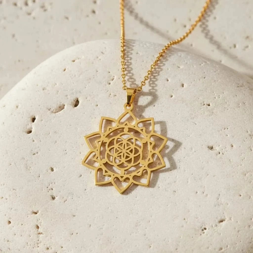 Gold lotus flower pendant on a black background