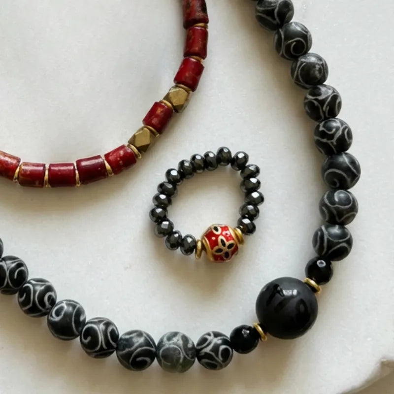 Coven First Look one-of-a-kind crystal jewelry collection — kyanite, peacock pearl, dzi bead, and yellow Swarovski sets