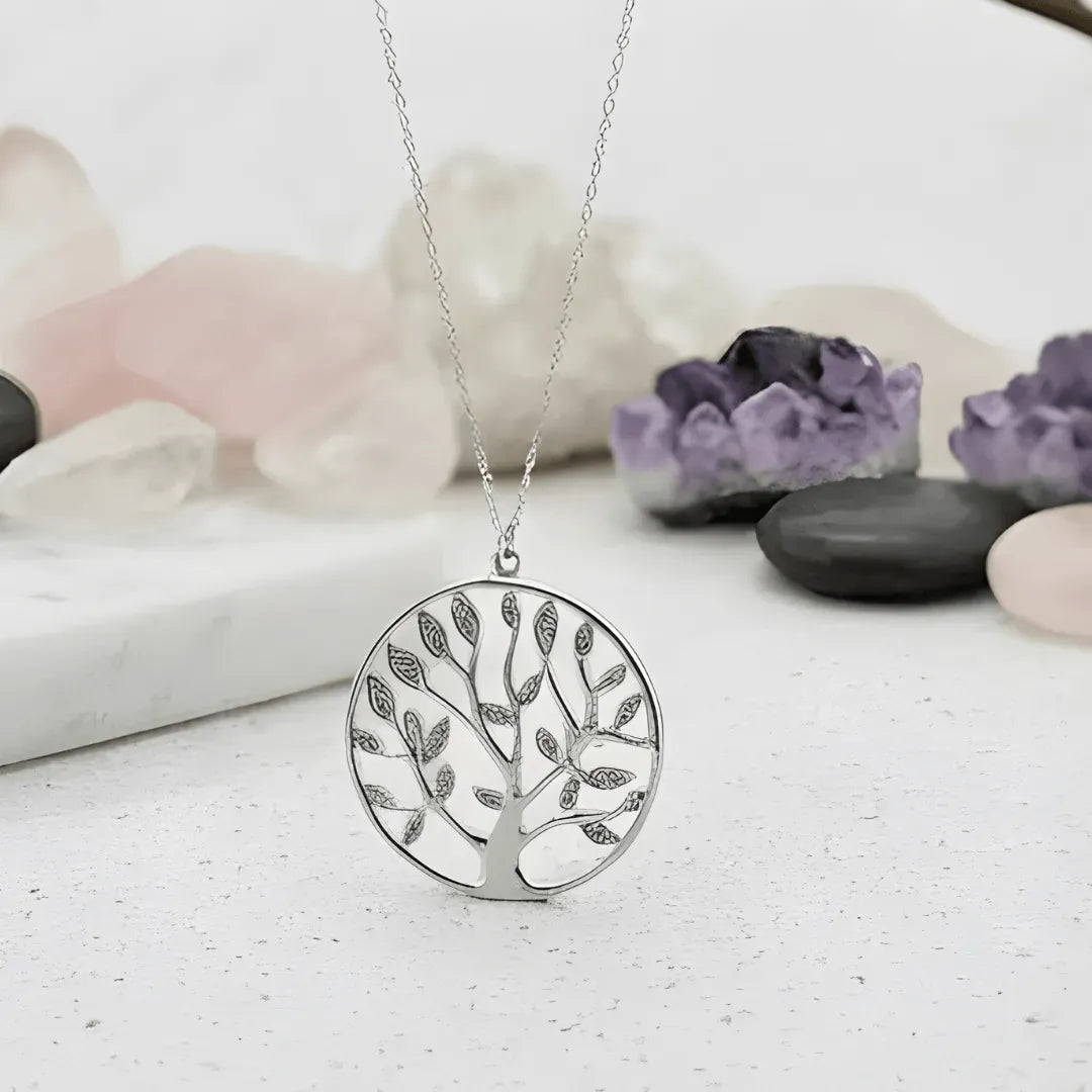 Gold crescent moon earrings on a white surface