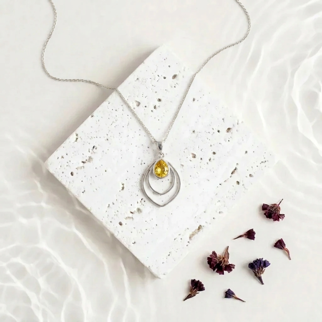 Silver Double Teardrop necklace with a citrine yellow faceted glass drop inside the open frame