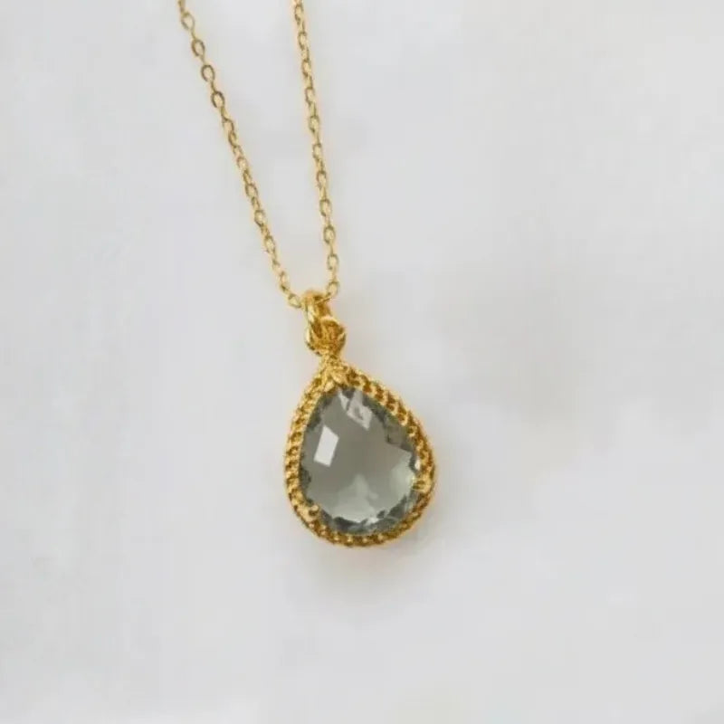 Gold plated Dusk Exquisite necklace with a smoky grey faceted glass pendant