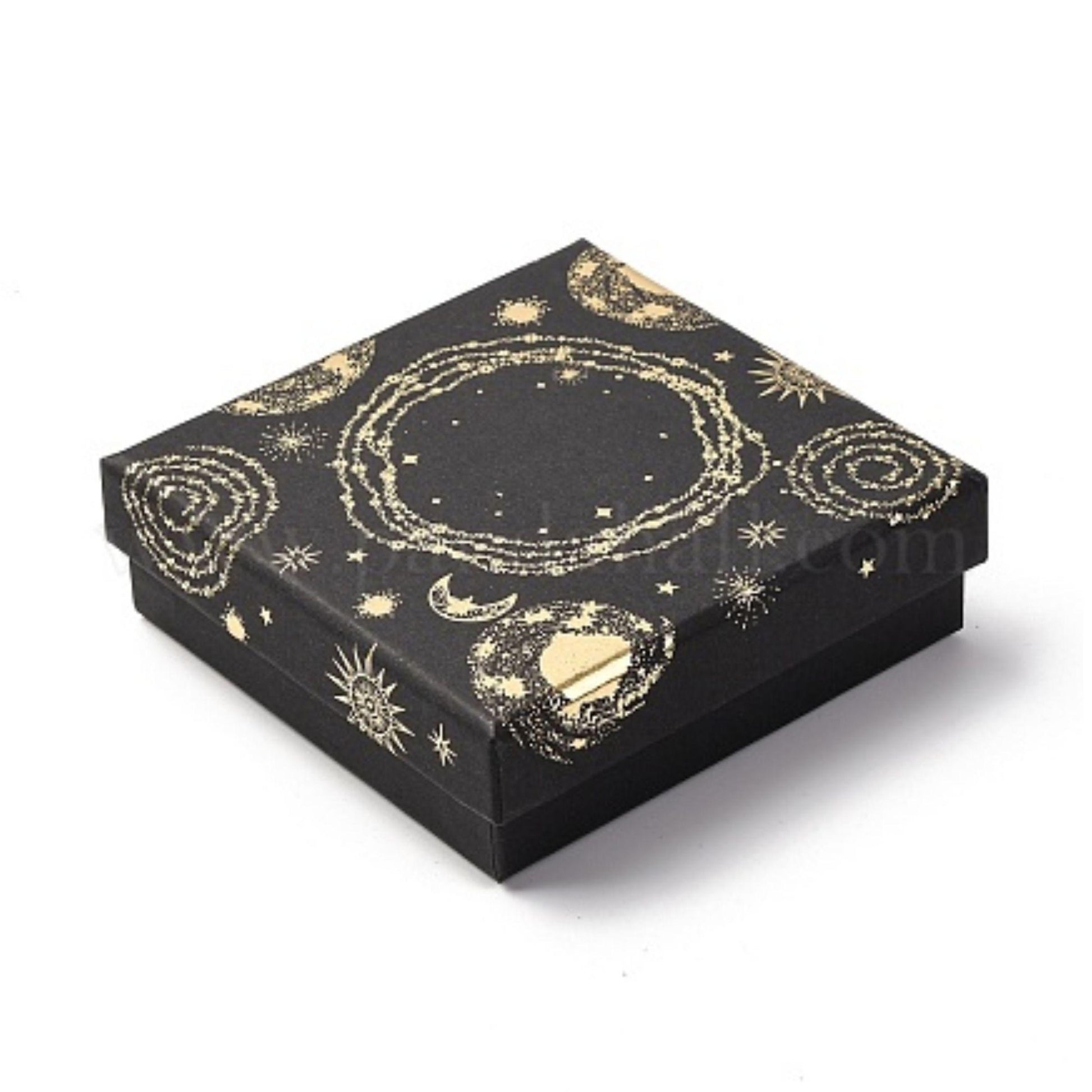 Black celestial gift box with gold foil sun and moon print, open to show a gold necklace on black velvet, beside a teal satin pouch and handwritten note card