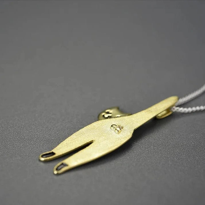 Gold Cat Necklace on grey background