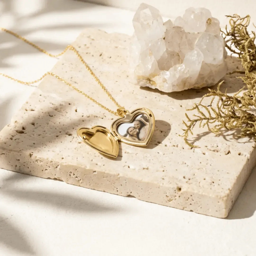 Gold heart locket necklace open to hold a photo — spiritual symbol jewelry for love and memory