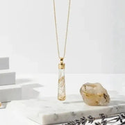 Golden rutilated quartz pendulum necklace — focused light, timeless minimalism
