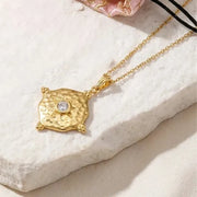 Gold hammered medallion necklace with CZ centre stone, waterproof stainless steel birthstone jewelry