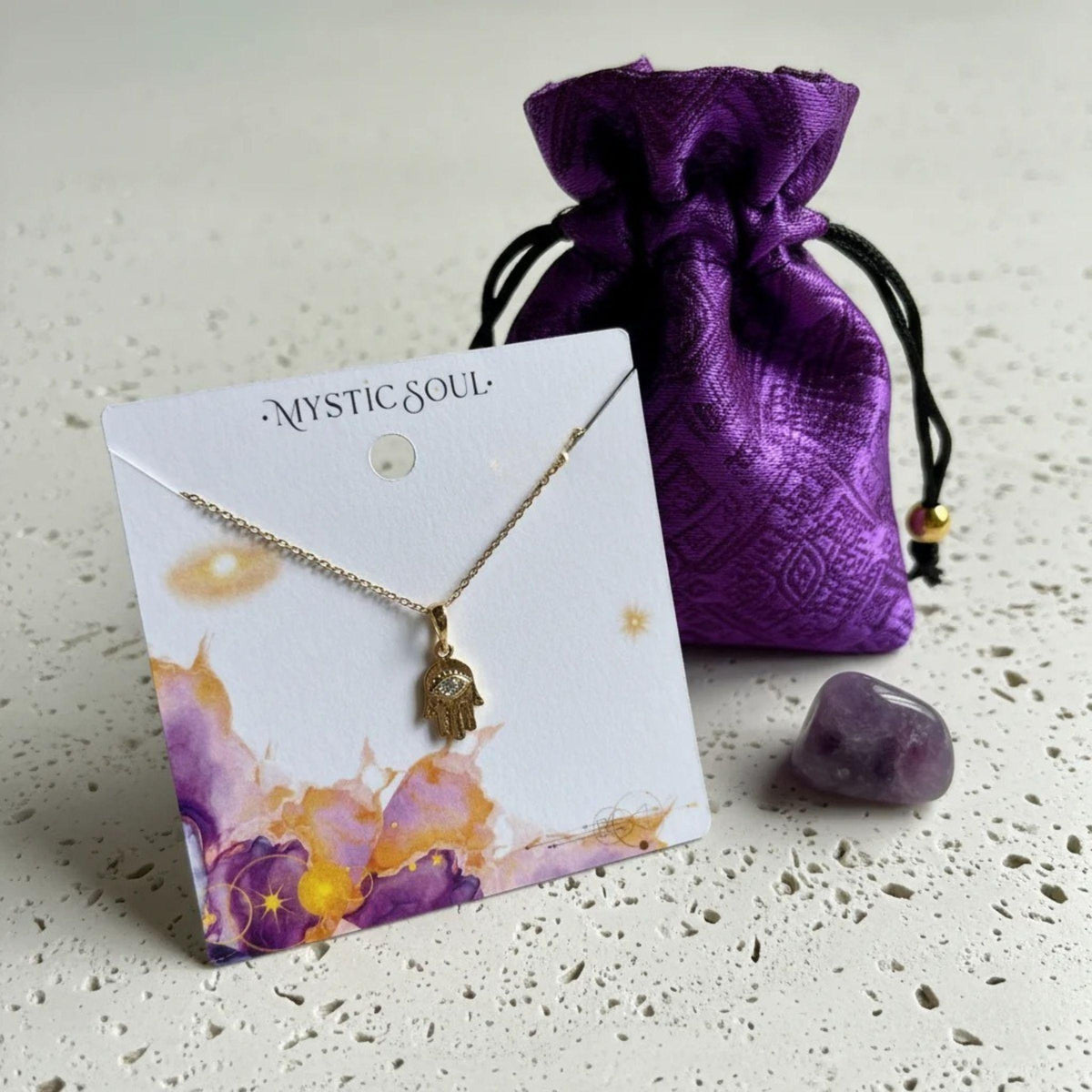 Hamsa hand necklace with crystal eye on a Mystic Soul gift card